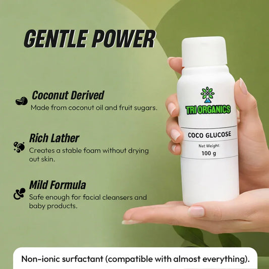 Hand holding Tri Organics Coco Glucose bottle, coconut-derived mild surfactant for skincare